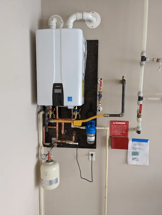 Professional plumber installing copper piping in a Zephyrhills North home